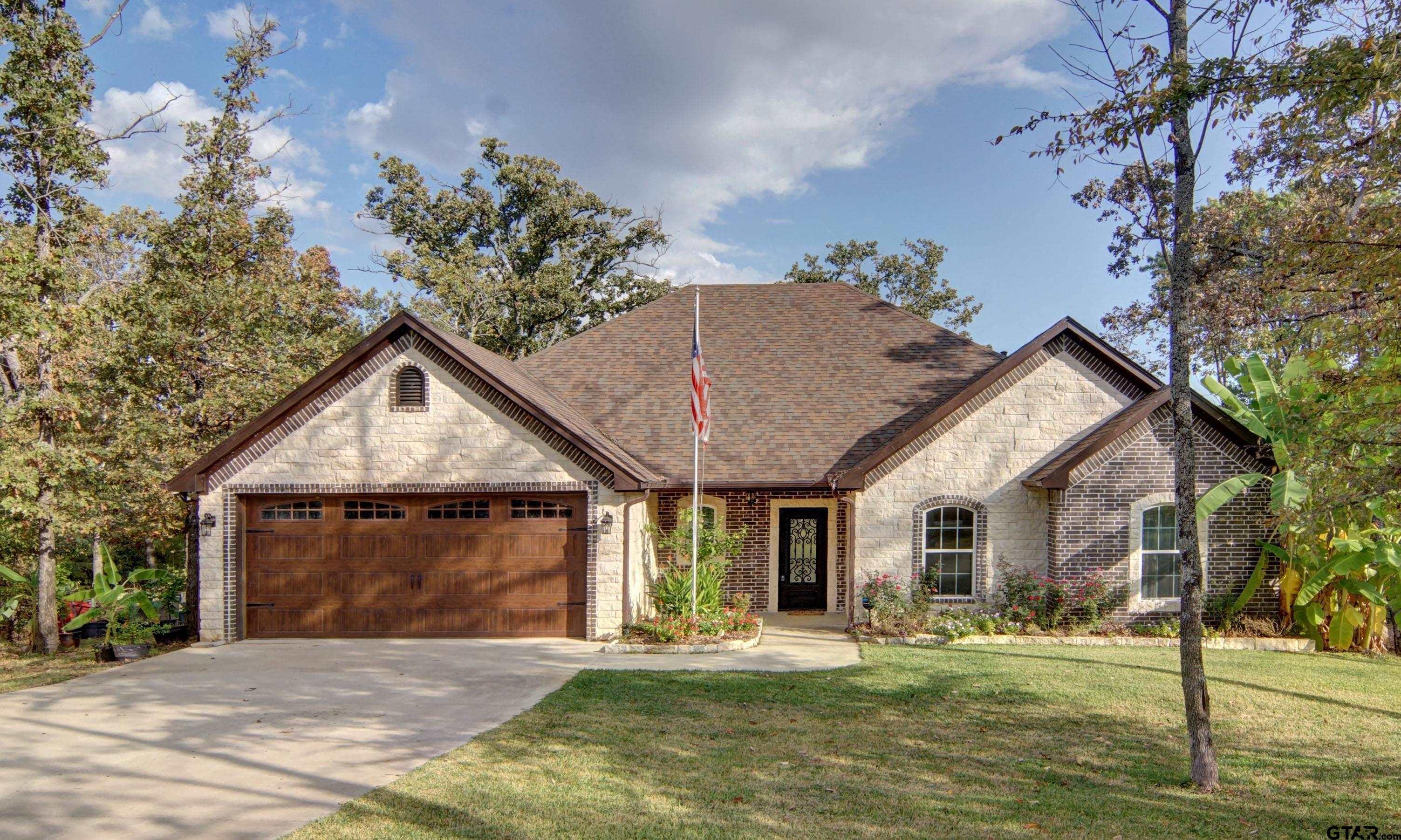 Image 1: Front view of house facing south