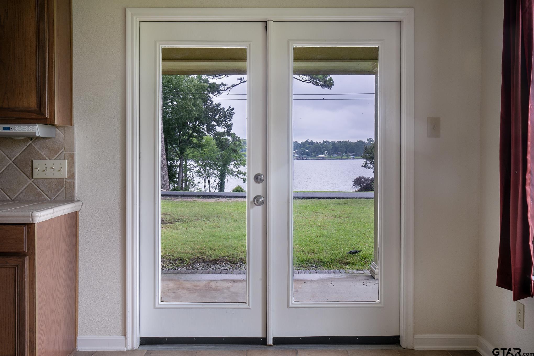 Image 4: Lake view from eat in Kitchen