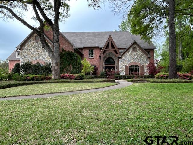 Image 1: INSTANT DRIVE-UP APPEAL; GORGEOUS PROFESSIONAL LANDSCAPING, LOVELY STONE EXTERIOR., FRONT ELEVATION