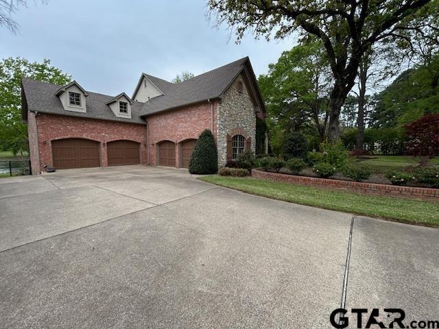 Image 3: OVERSIZED, ROOM FOR STORAGE OR SHOP AREA.  LARGE ATTIC LIFT IN GARAGE., 4-CAR GARAGE