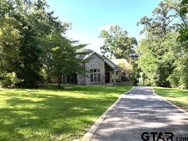 Image 3: PEACEFULLY SITS BACK OFF ROAD WITH SECURITY GATED ENTRY., VIEW FROM ROAD