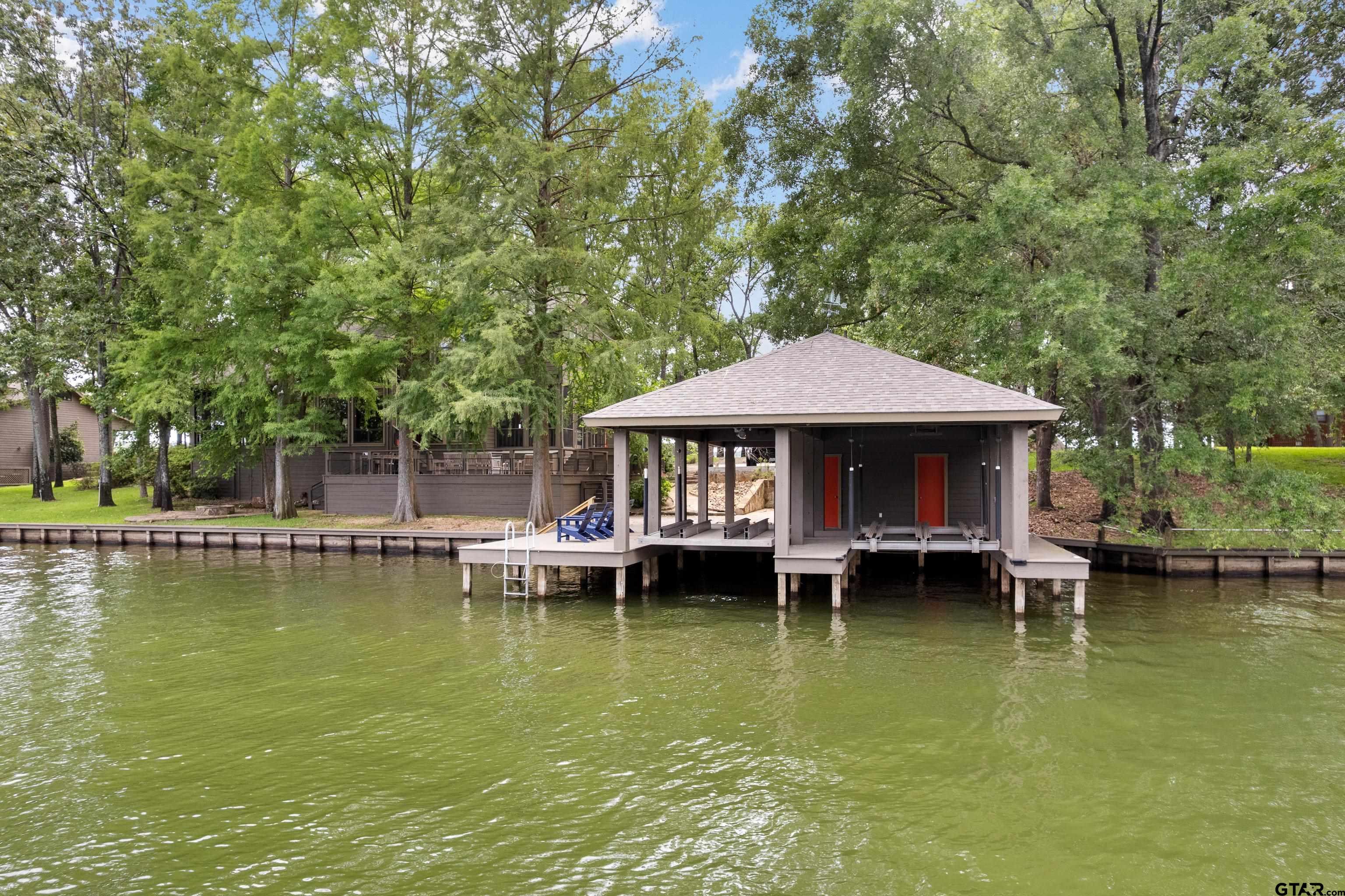 Image 3: 2-Stall Boathouse in Calm Water