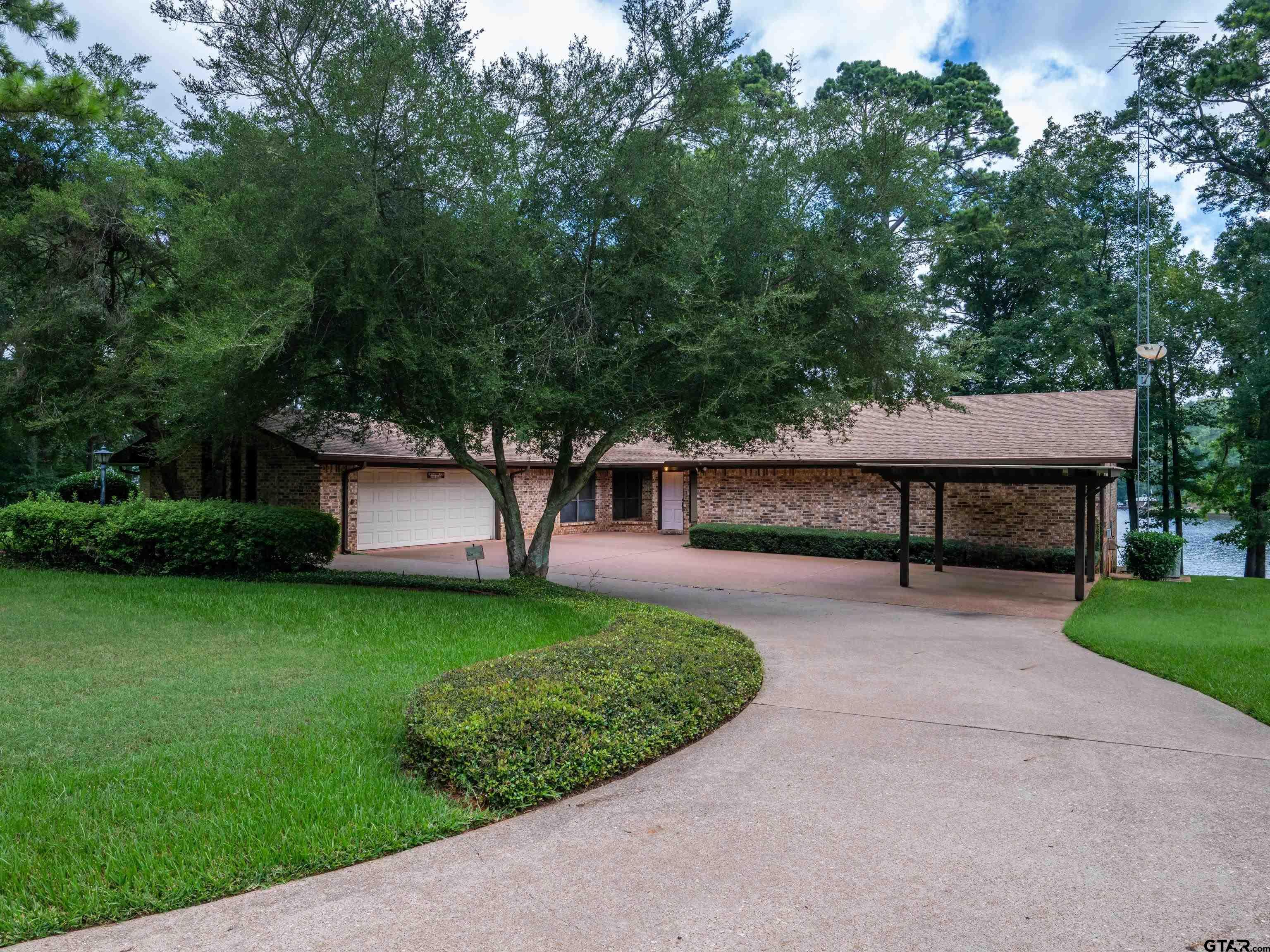 Image 3: 2 Car Garage & 1 Carport