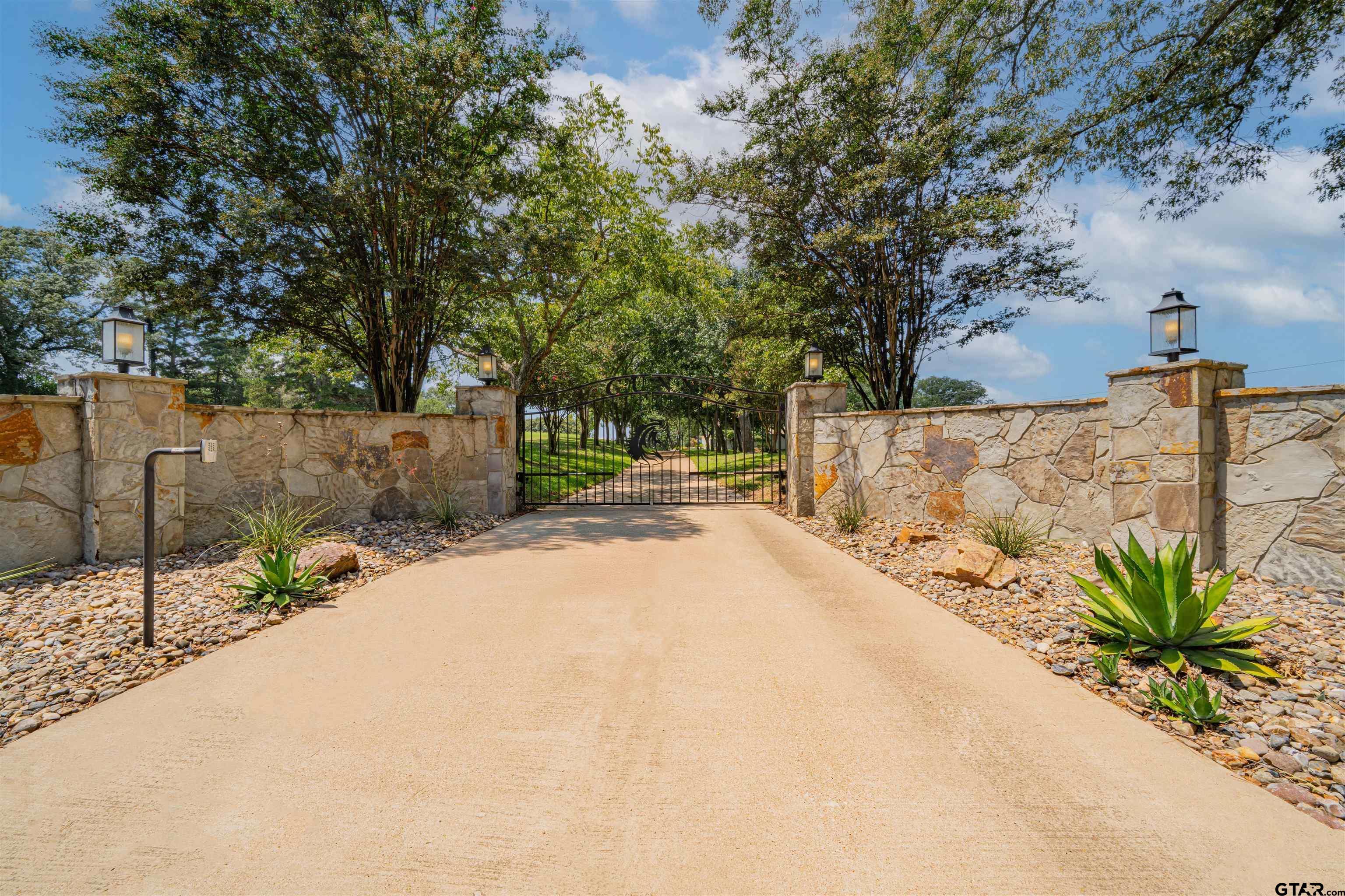 Image 0: Gated Entry to Property