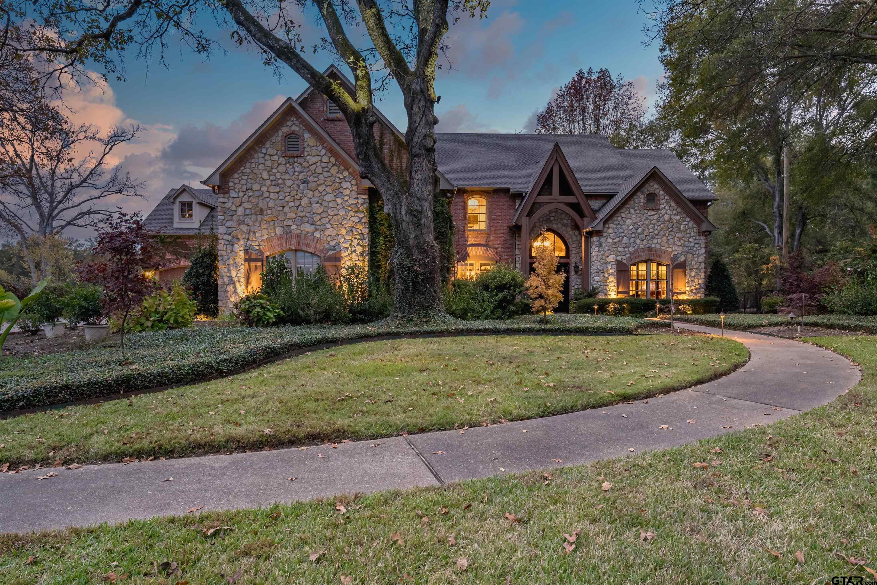 Image 0: INSTANT DRIVE-UP APPEAL; GORGEOUS PROFESSIONAL LANDSCAPING, LOVELY STONE EXTERIOR., FRONT ELEVATION