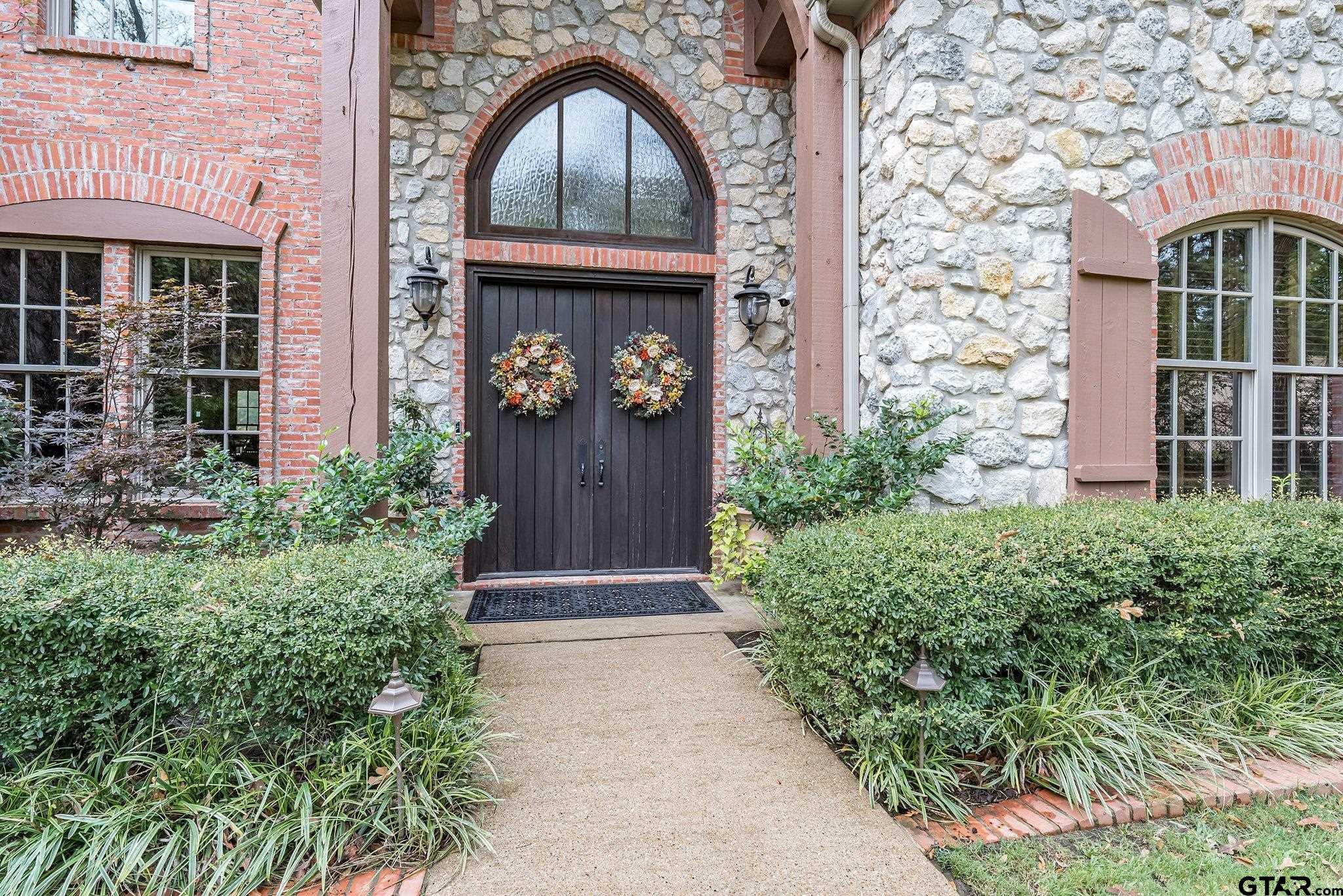 Image 2: IMPRESSIVE ENTRY W/DOUBLE WOODEN DOORS ENHANCED BY ARCHED WINDOWS., FRONT ETRY