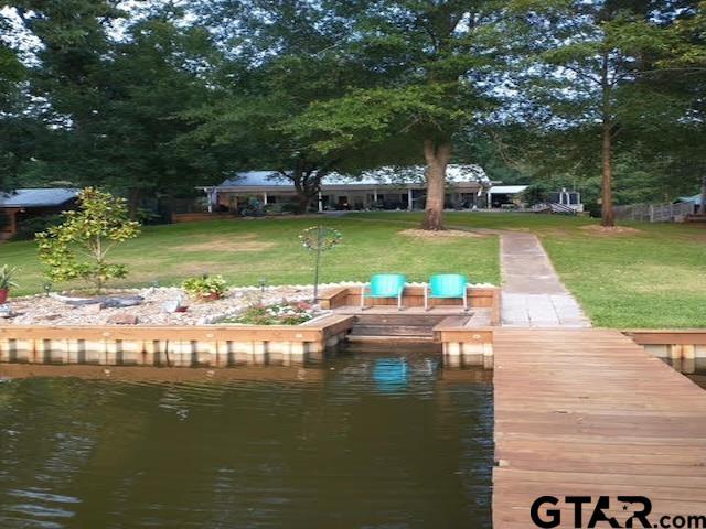 Image 1: Back of House From Lake in Spring/Summer, Back of House from Lake in Spring/Summer