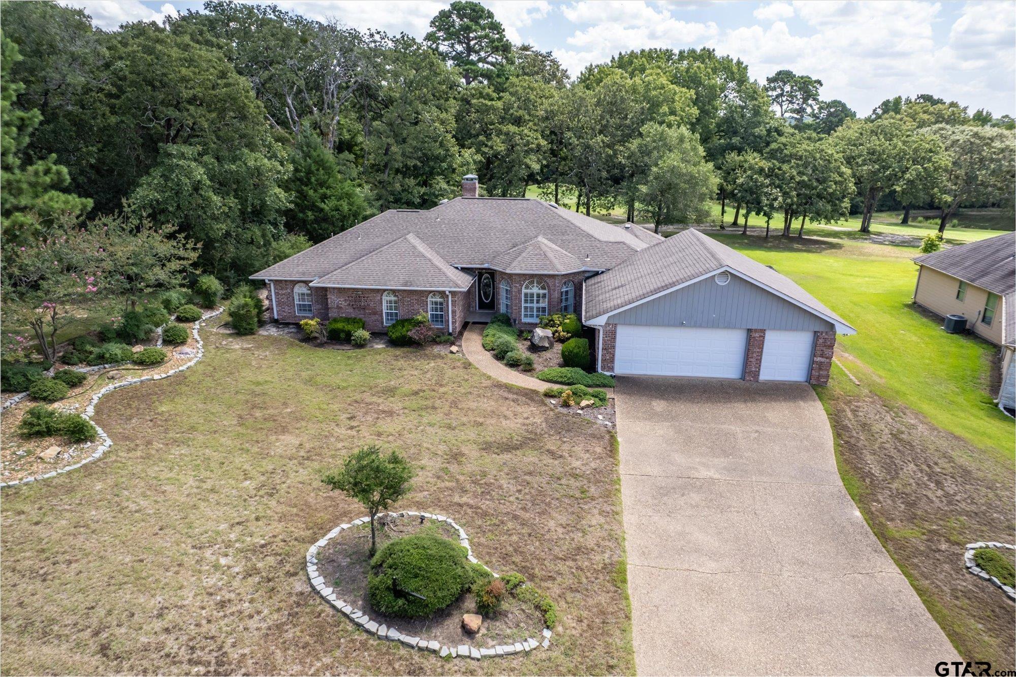 Image 0: Gorgeous brick home overlooking golf course