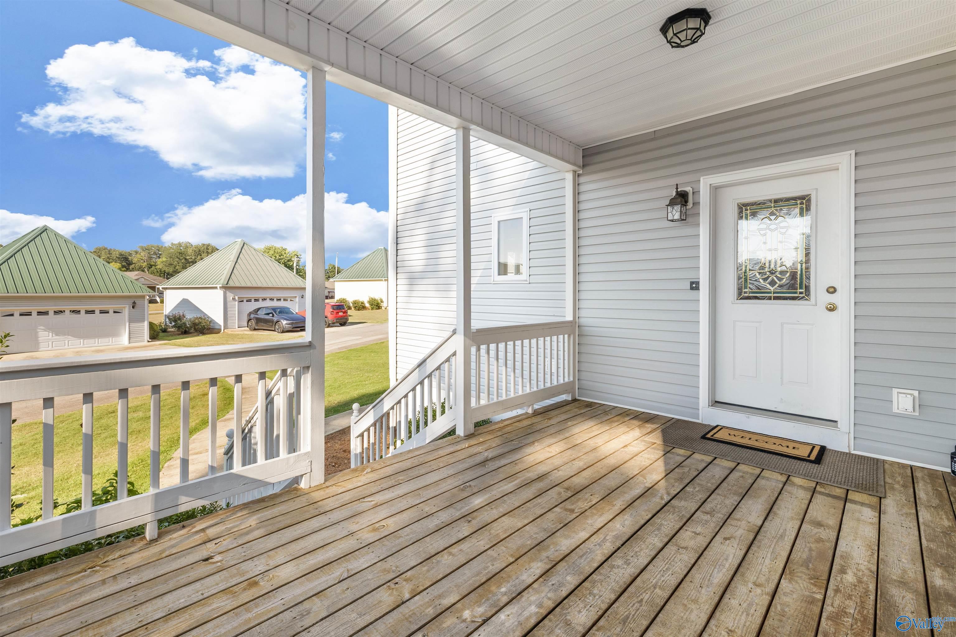 Image 3: Large covered porch- perfect for watching the grandkids go by on the golf cart and space for all those Amazon packages!