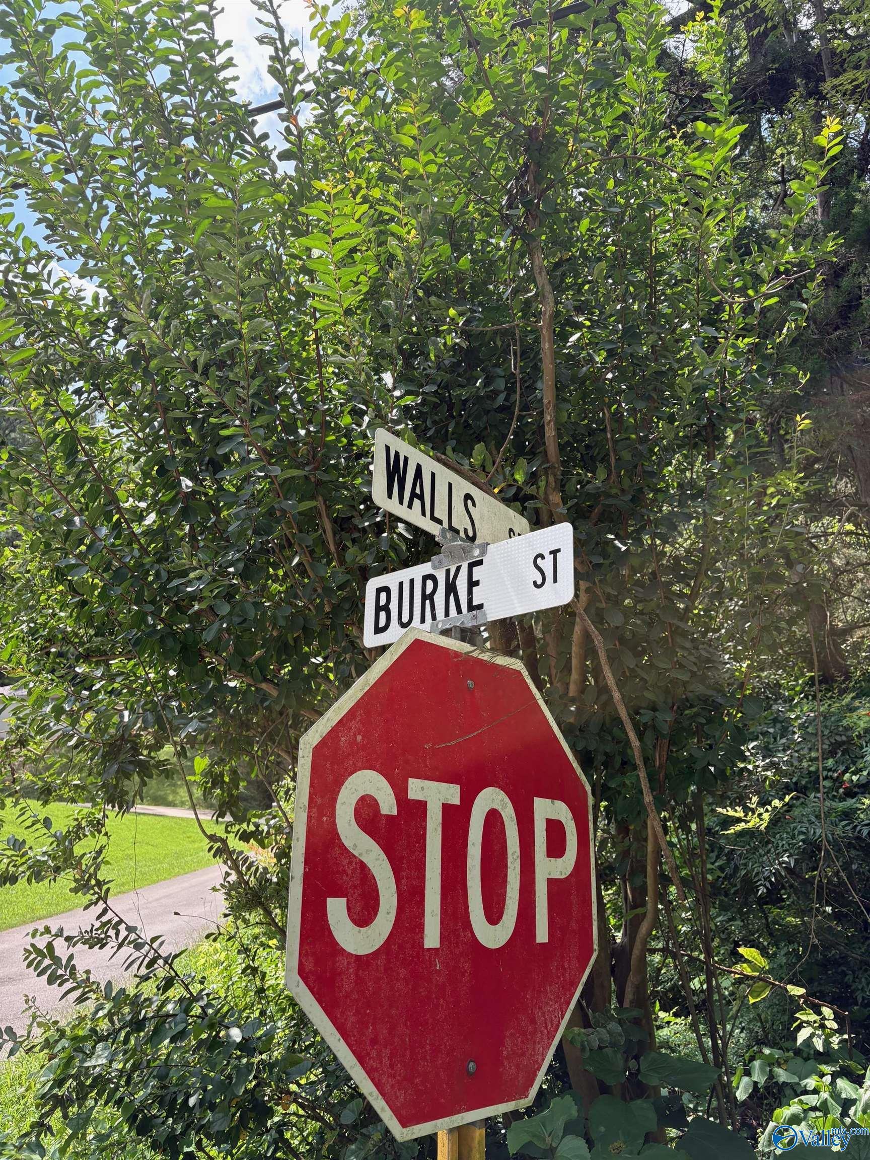 Image 1: This sign is on the opposite corner of the property