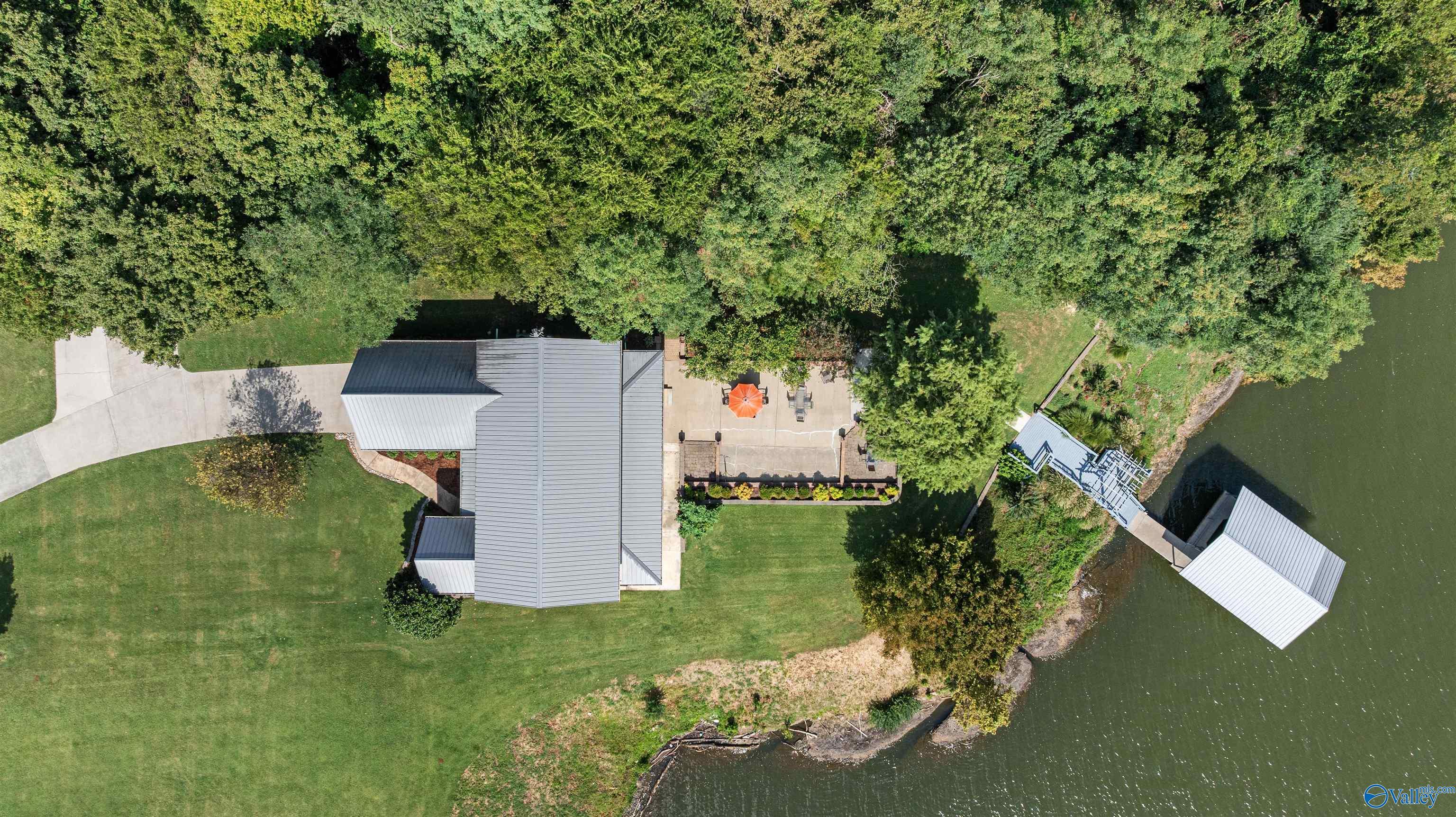 Image 2: Overhead of the Main home down to the dock... look at all that entertaining space! Plenty of room for your family and friends!