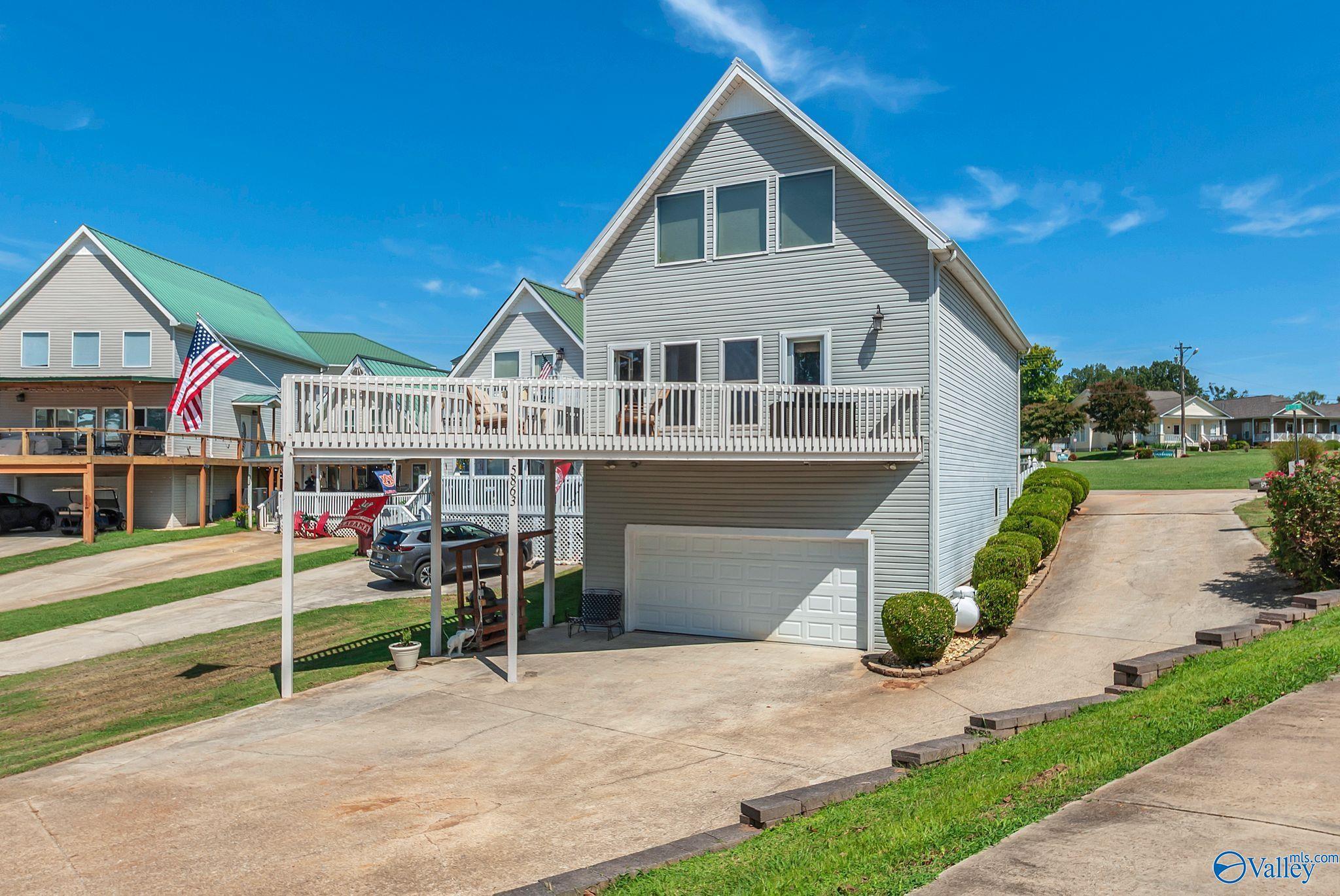 Image 3: The river always brings the question... is the front the back? Or the back the front? Either way... plenty of garage space, packing, room for your grill and your boat!