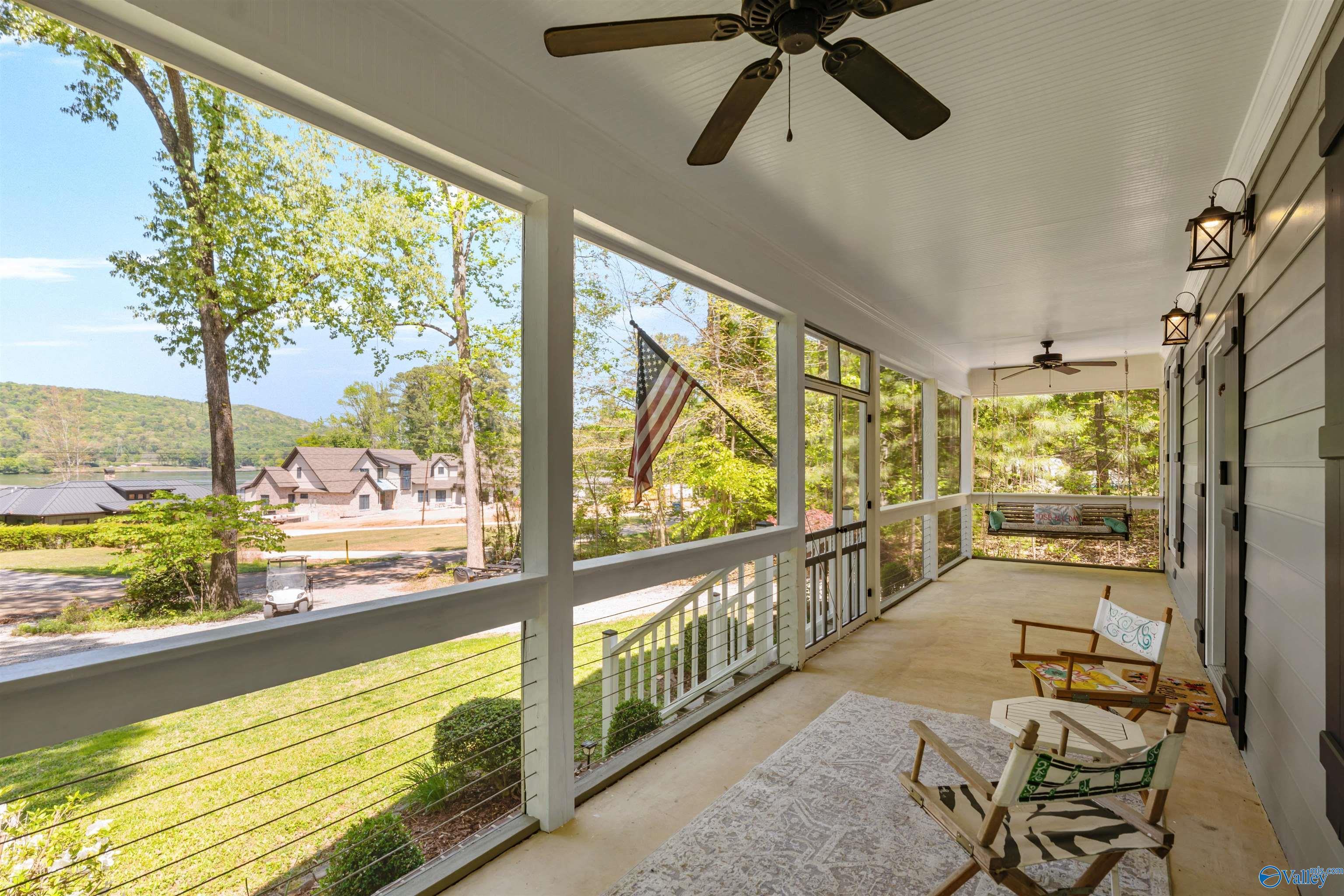 Image 4: Take in the beautiful view of the lake from the screened in front porch