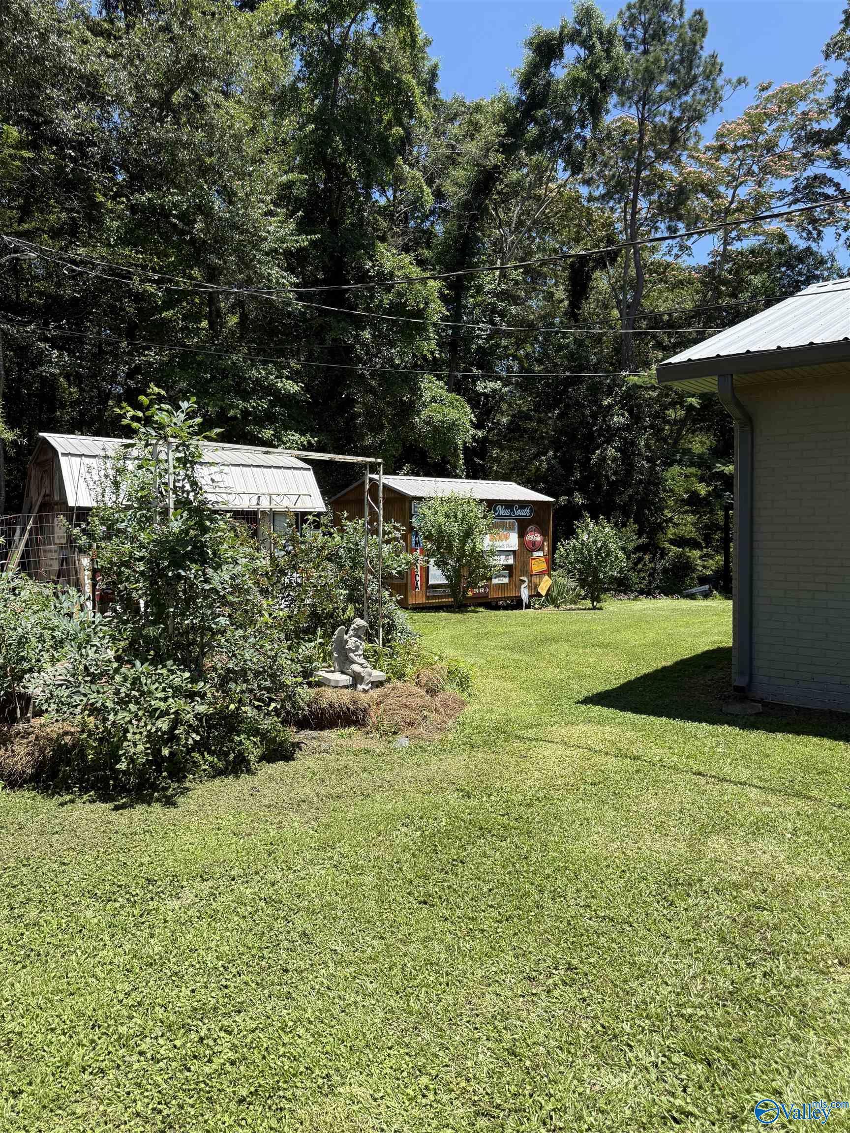 Image 3: Back yard area with outdoor worksheds