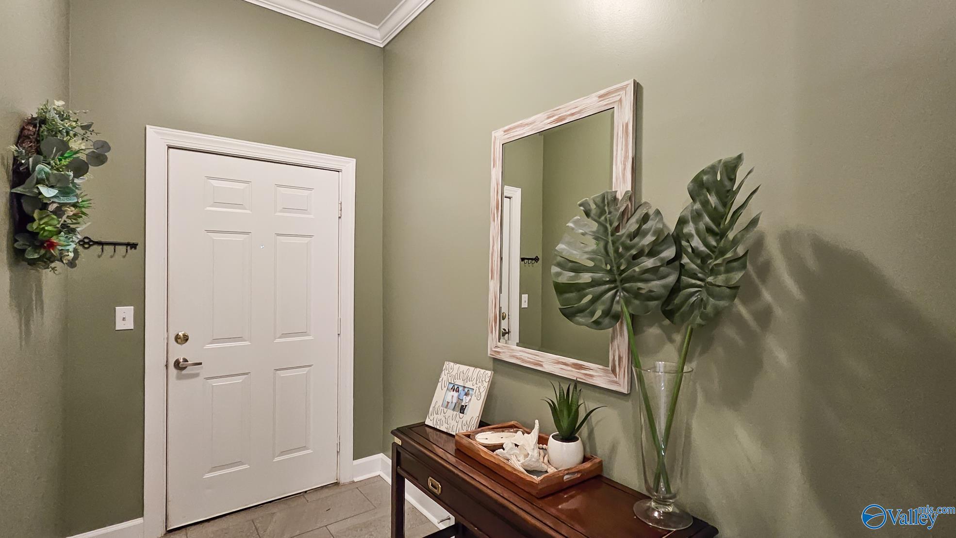 Image 4: A warm and welcoming foyer sets the tone for the rest of the home.