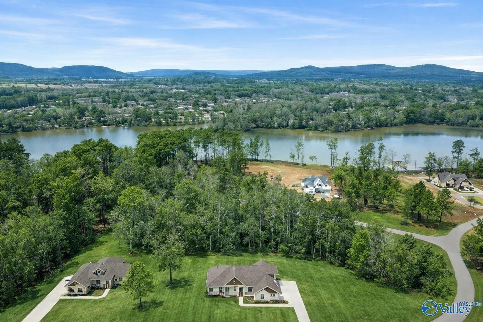 Image 2: 20 ft pathway and boathouse are approved and about to begin construction! Home includes a two slip boathouse directly on the water!!!