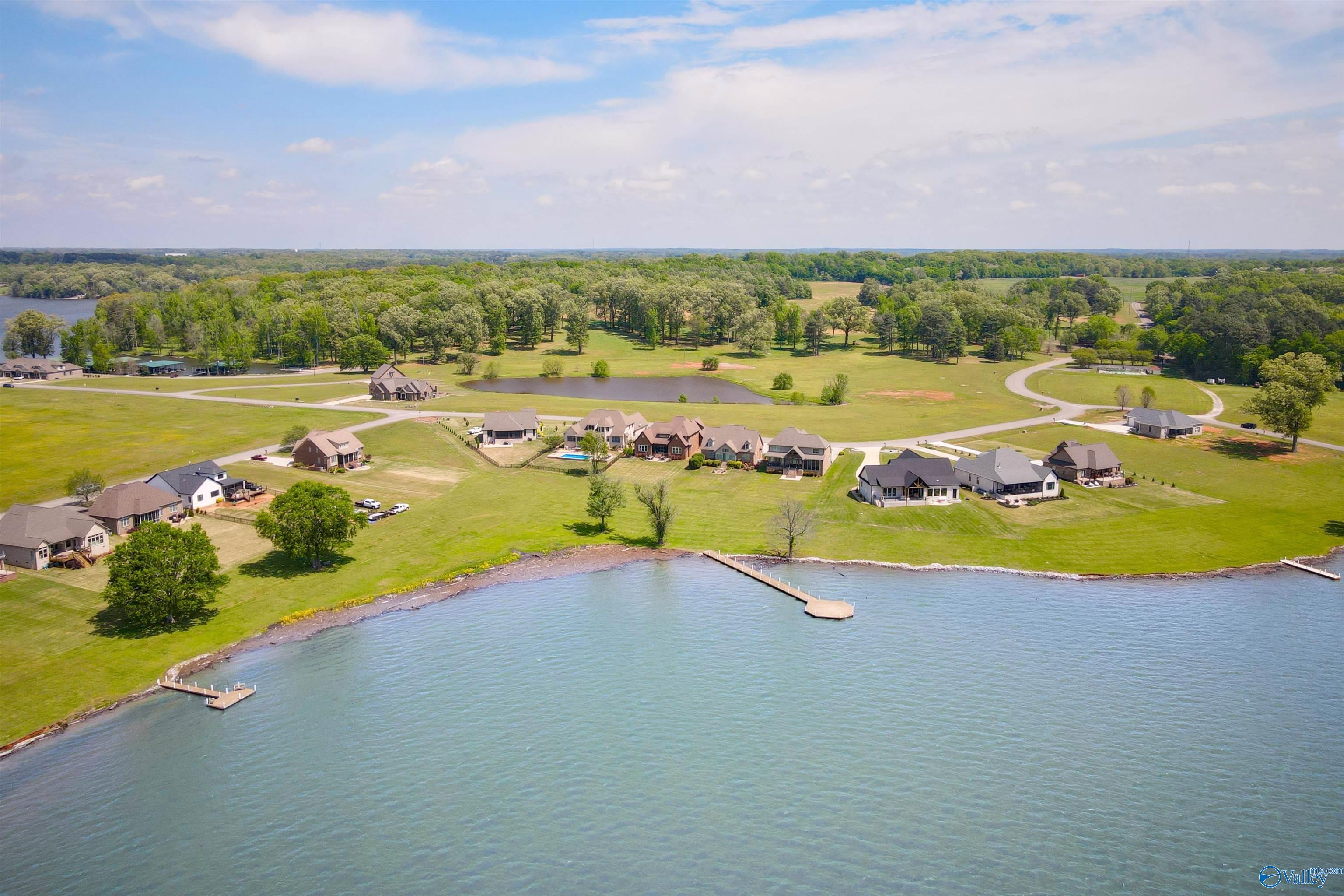 Image 4: The shared day dock is just steps away from your back door.  A large boat slip is available to purchase at the residents marina.
