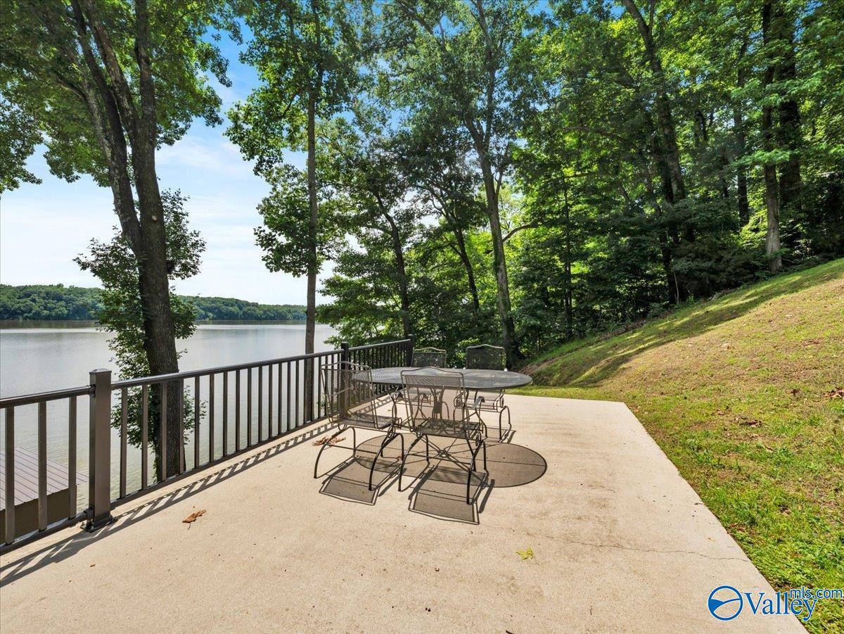Image 1: Enjoy front-row views of the Elk River from this inviting patio, where waterfront scenery creates the perfect setting for quite, peaceful time or entertaining.