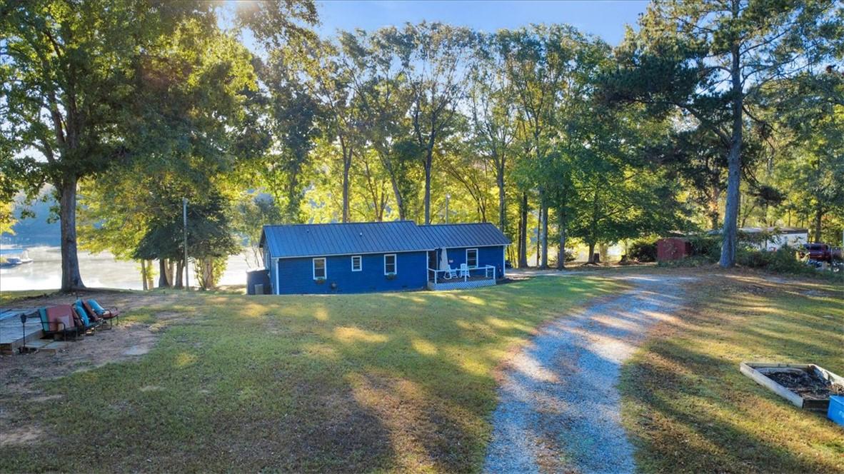 Image 1: This tranquil waterfront retreat offers a charming