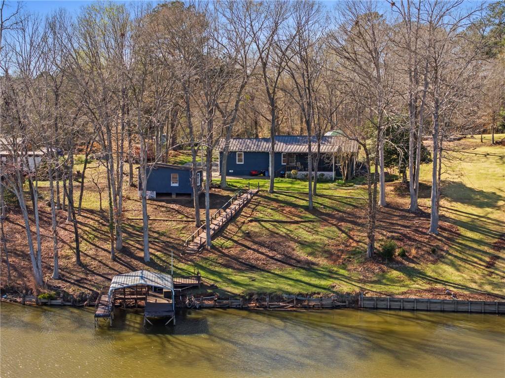 Image 2: This lakeside home offers serene waterfront living