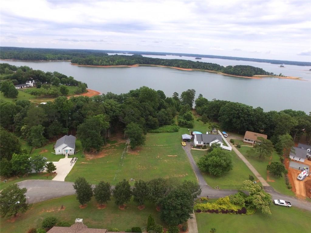 Image 4: An aerial panorama reveals a waterfront estate wit
