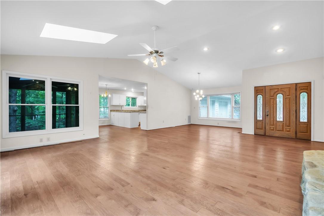 Image 2: Natural light and hardwood floors grace this spaci