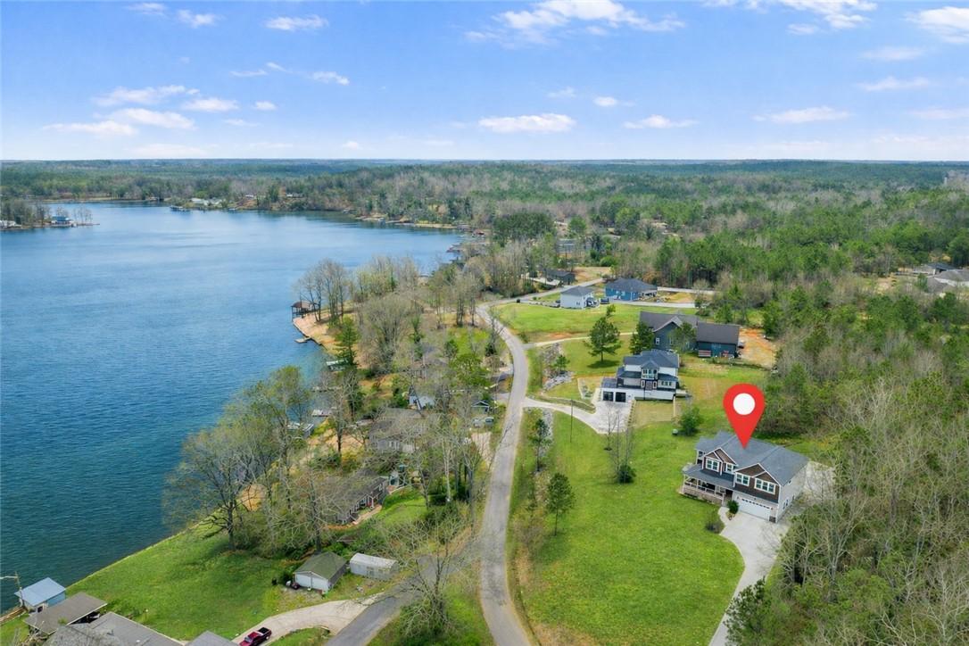 Image 2: This aerial perspective showcases a vibrant lake c