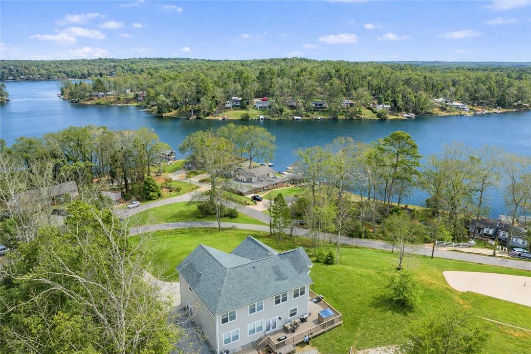 Image 3: Perched above a lake, this serene property feature