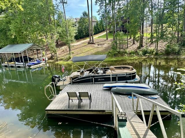 Image 3: A tranquil lakefront setting offers an expansive p