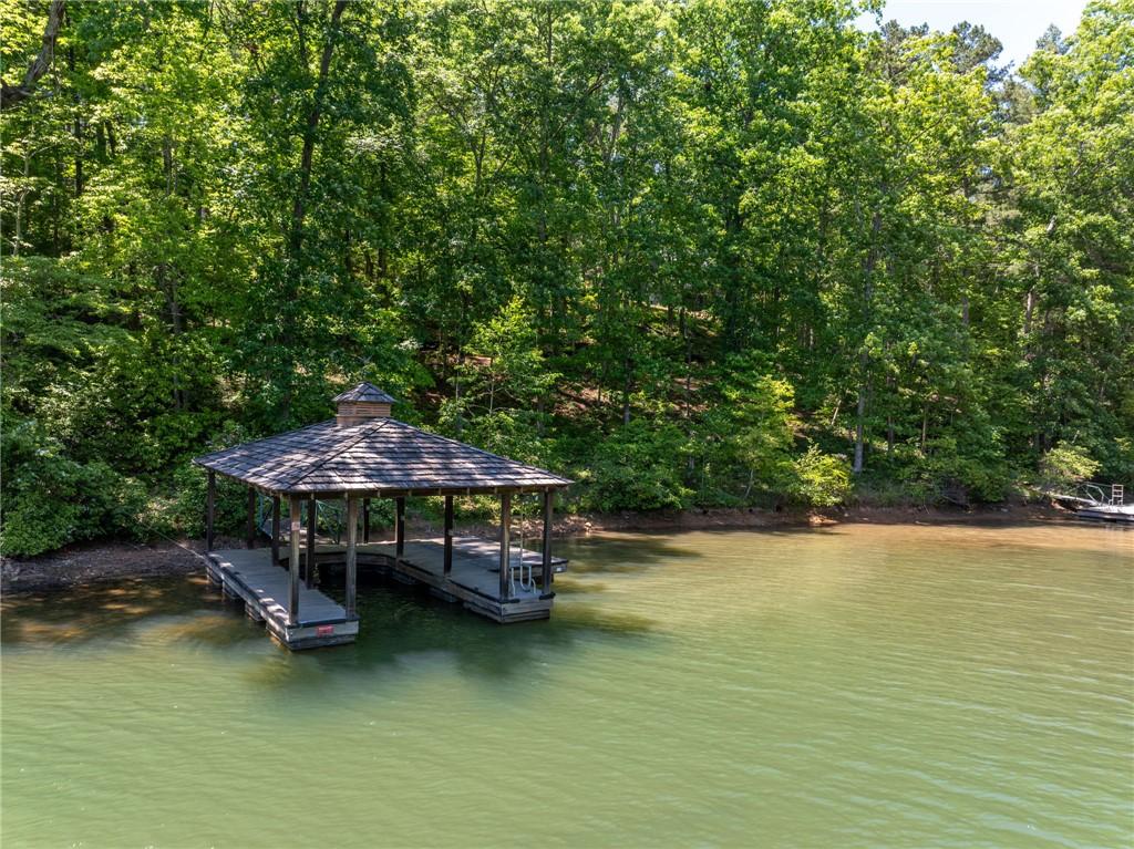 Image 2: This tranquil waterfront setting features a covere
