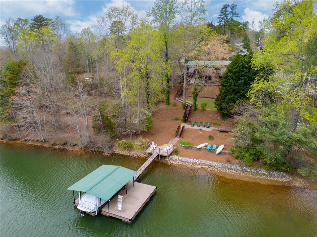 Image 2: This serene waterfront property offers direct lake