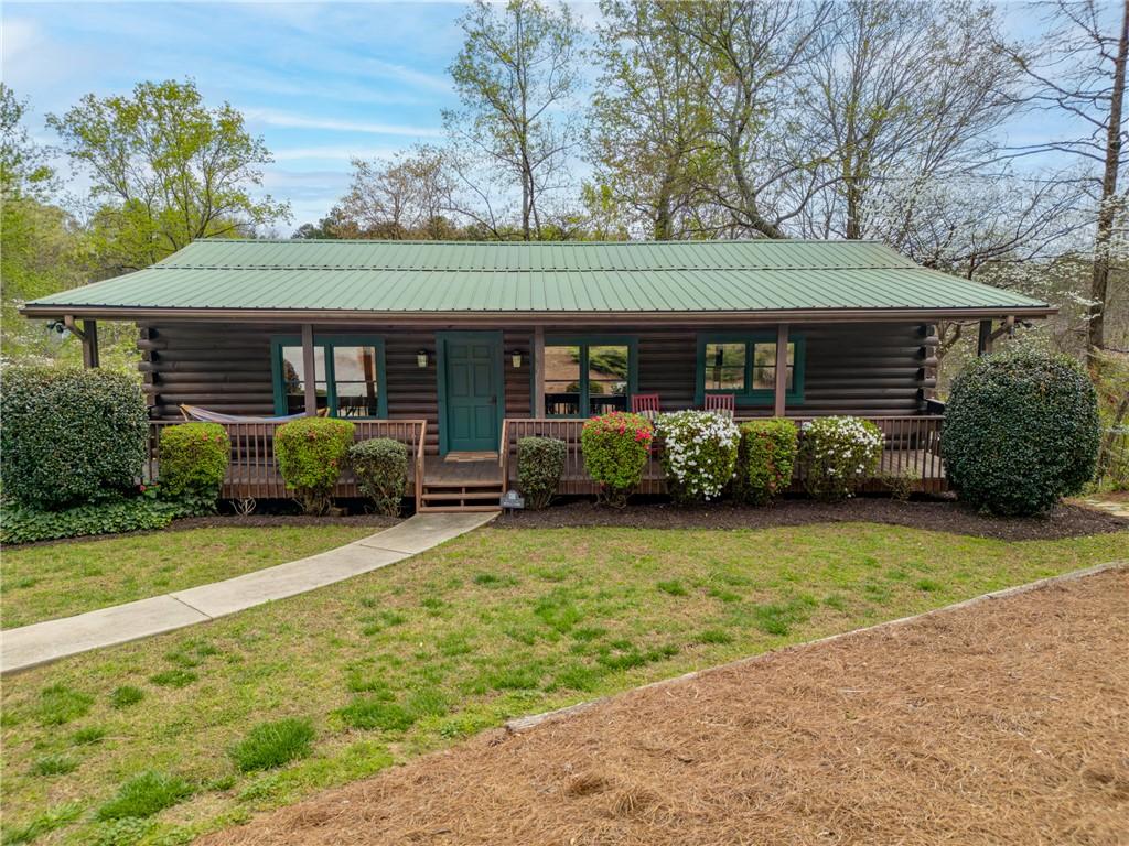 Image 4: This charming cabin home provides a peaceful escap