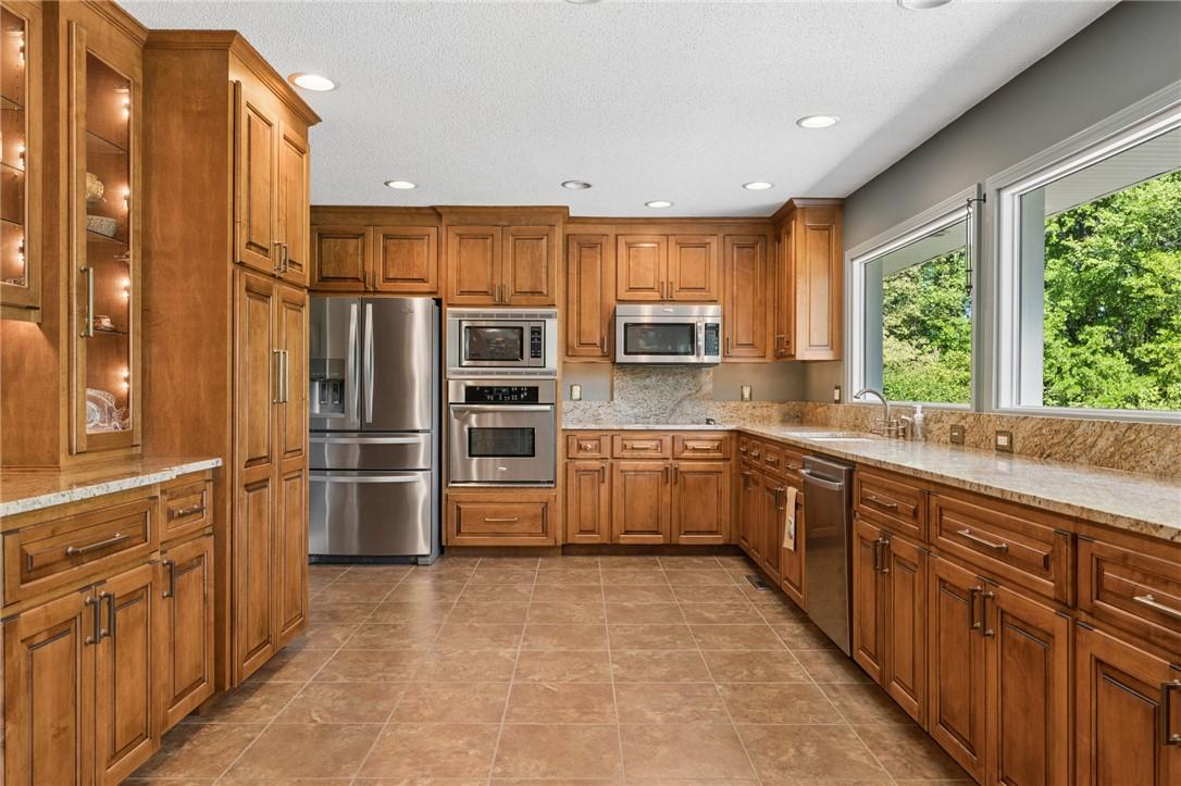 Image 3: This kitchen features stainless steel appliances,