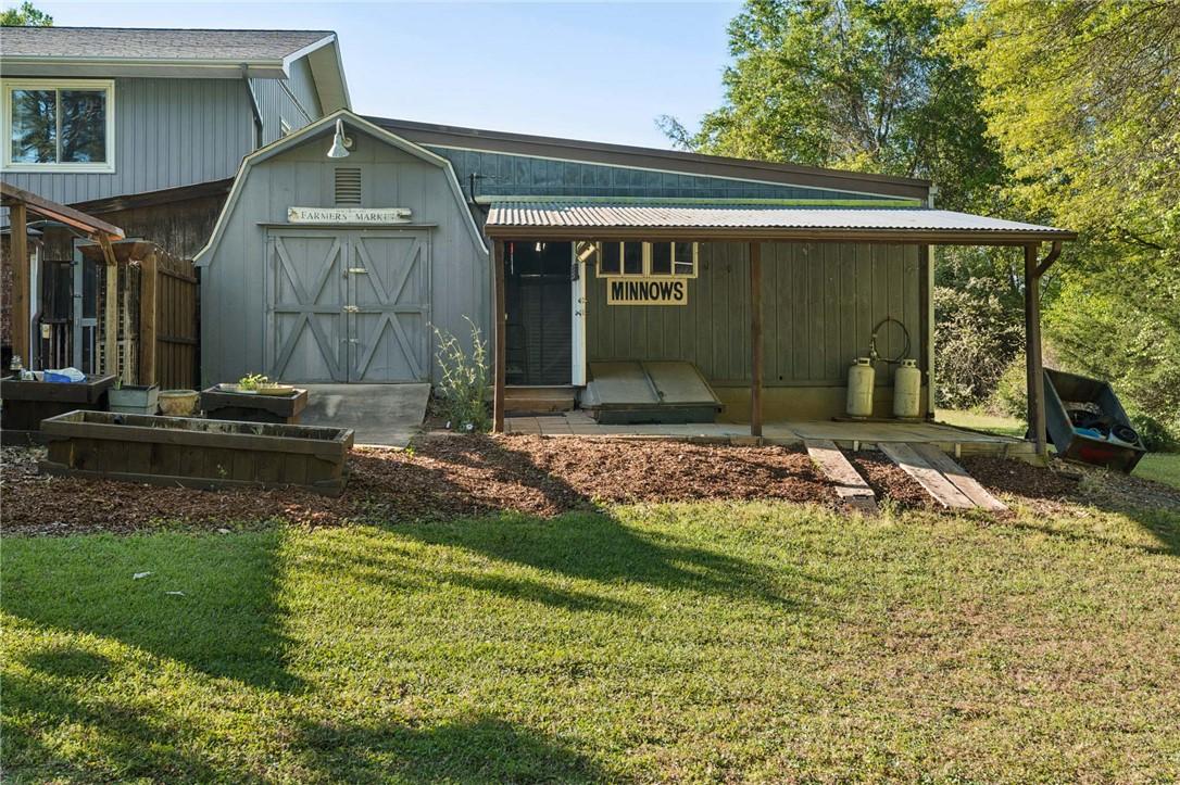 Image 4: This outdoor scene features a charming shed with a