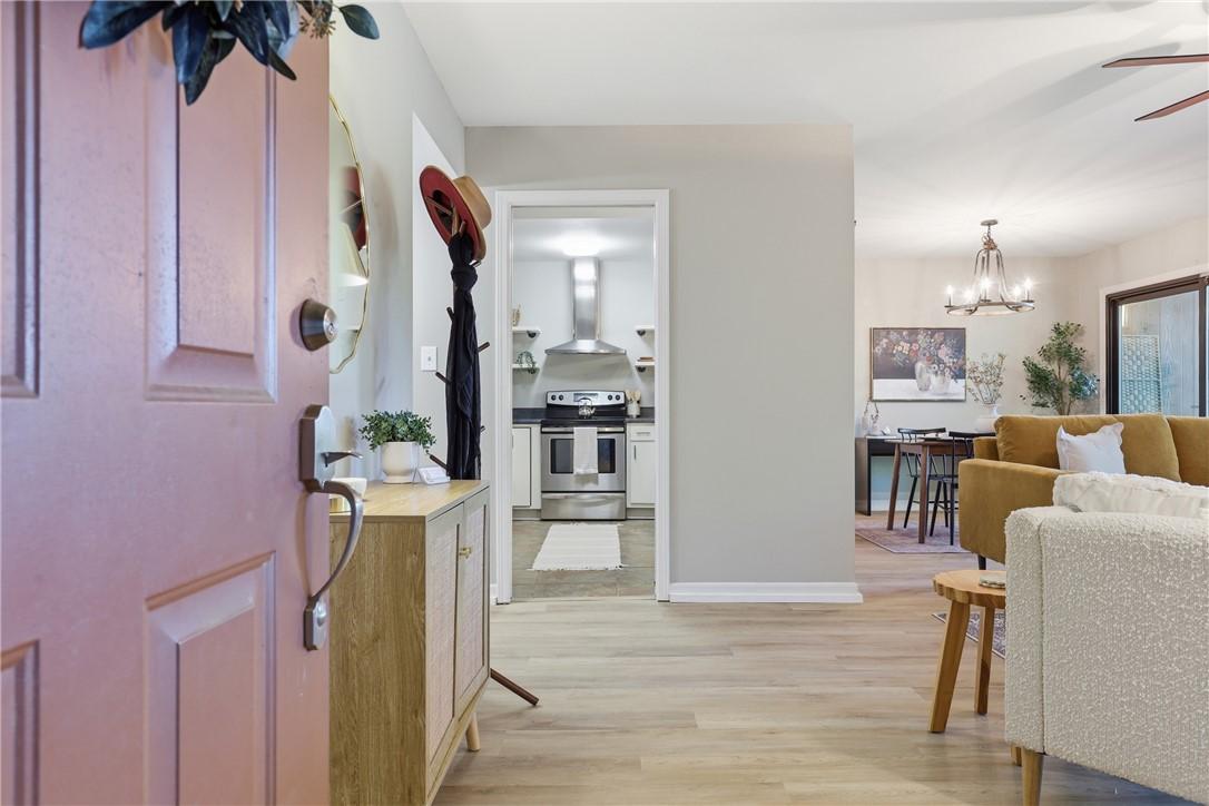 Image 3: This bright and airy residence showcases seamless