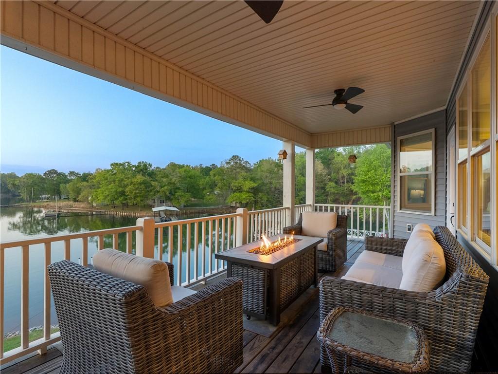 Image 4: This inviting porch offers tranquil views of the l