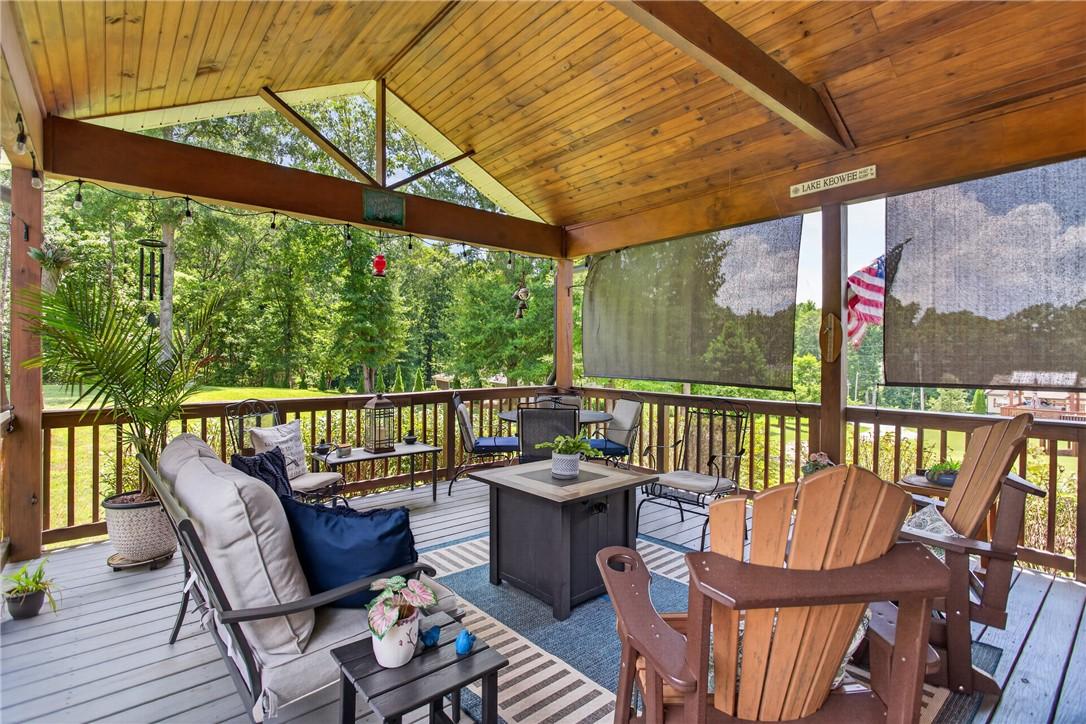 Image 4: A spacious covered porch beckons with serene views