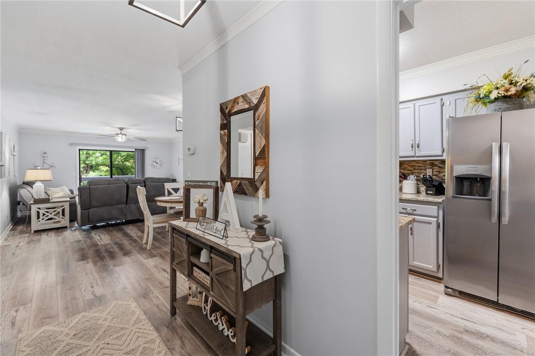 Image 3: An inviting open-concept layout connects the livin