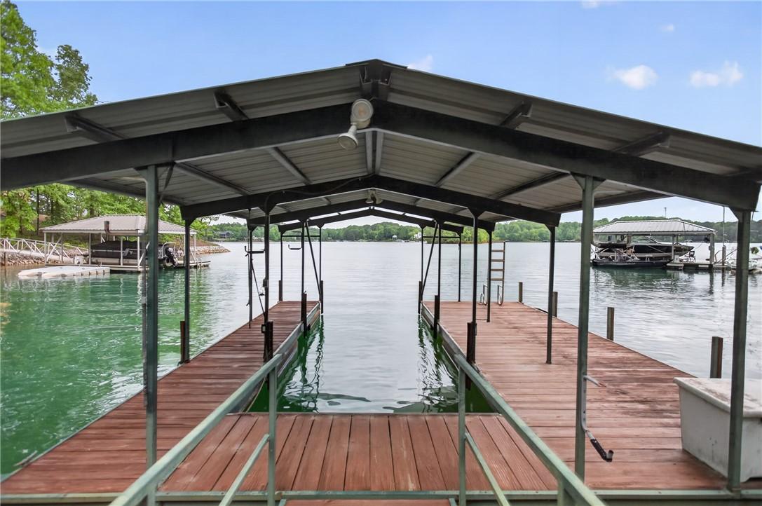 Image 2: A private boat dock and covered slip provides seam