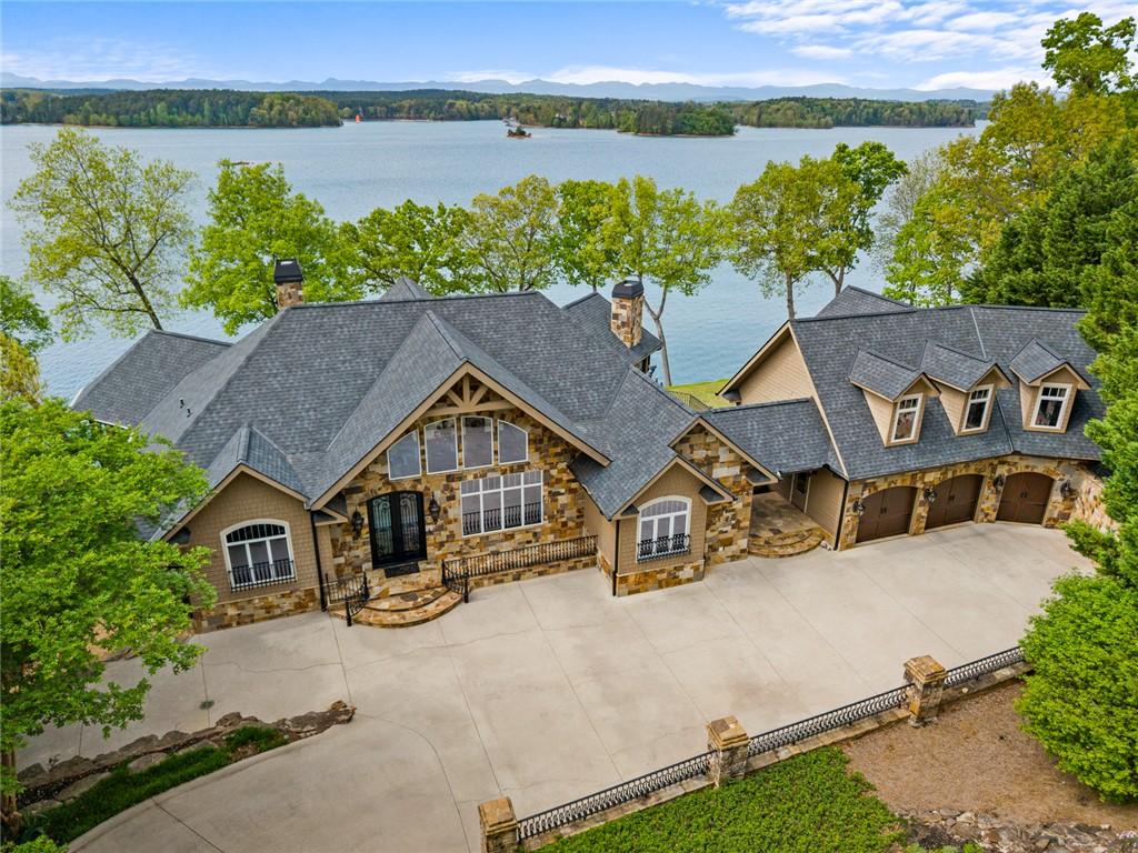 Image 1: Lakeside luxury estate with a three-car garage and