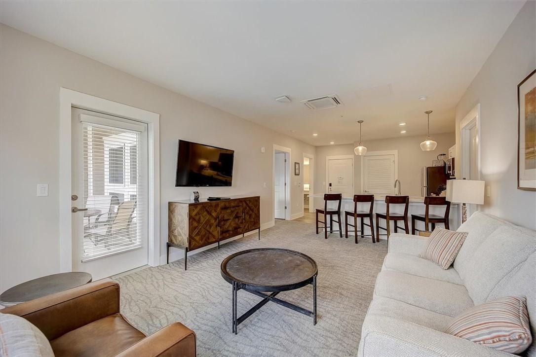 Image 2: An open-concept layout unites the living area and