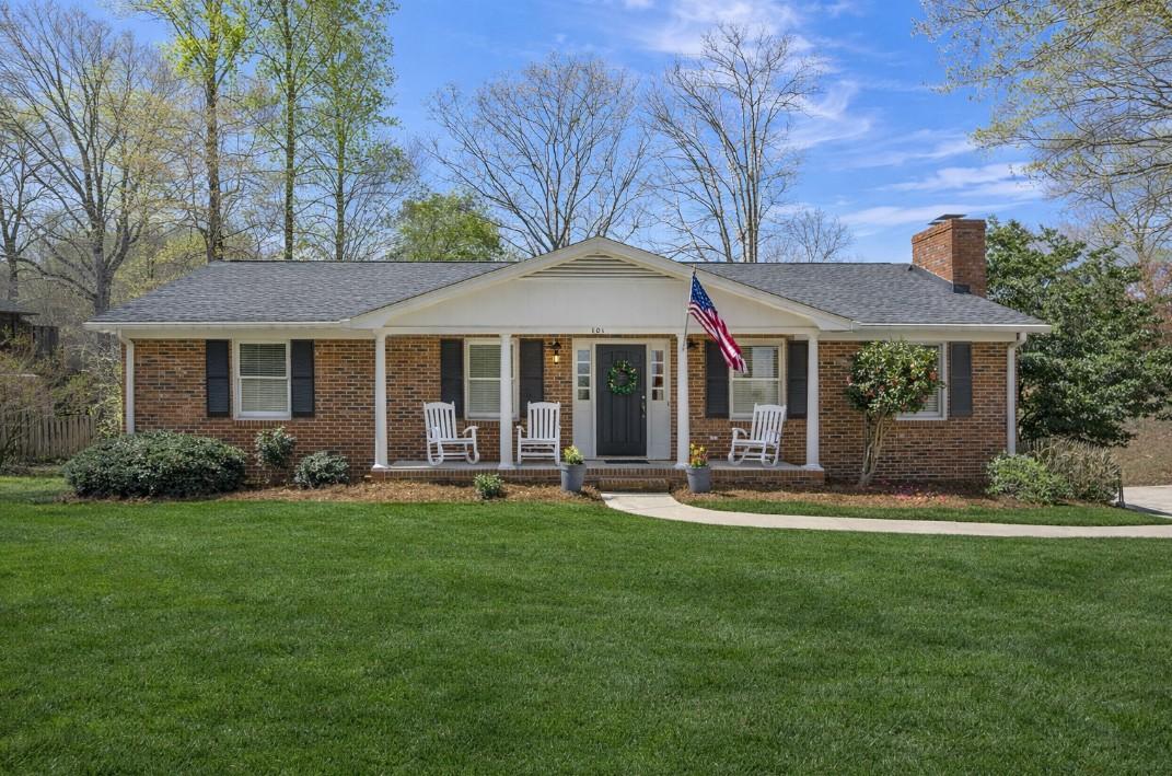Image 3: Virtual chairs and grass. Charming brick residence