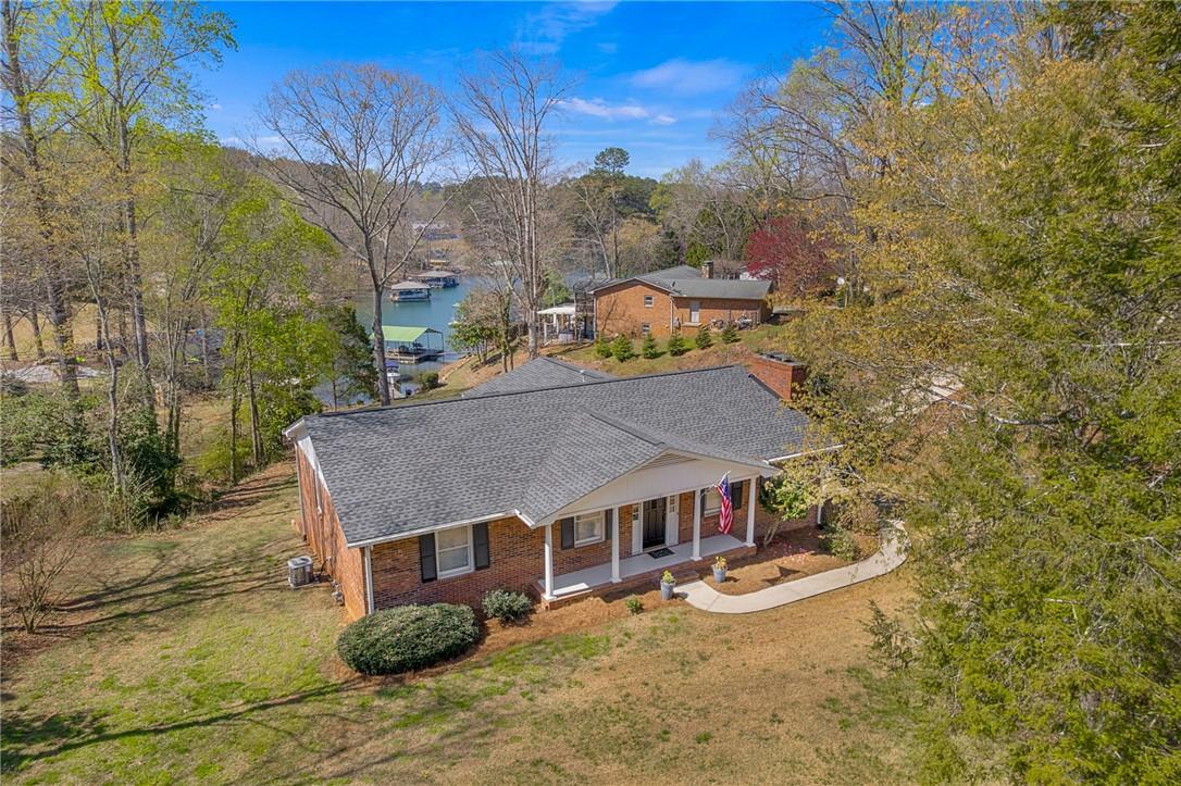 Image 4: This charming lakeside home offers serene water vi