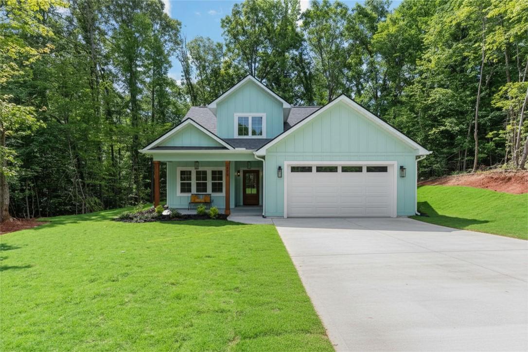 Image 1: A charming craftsman-style residence with a welcom