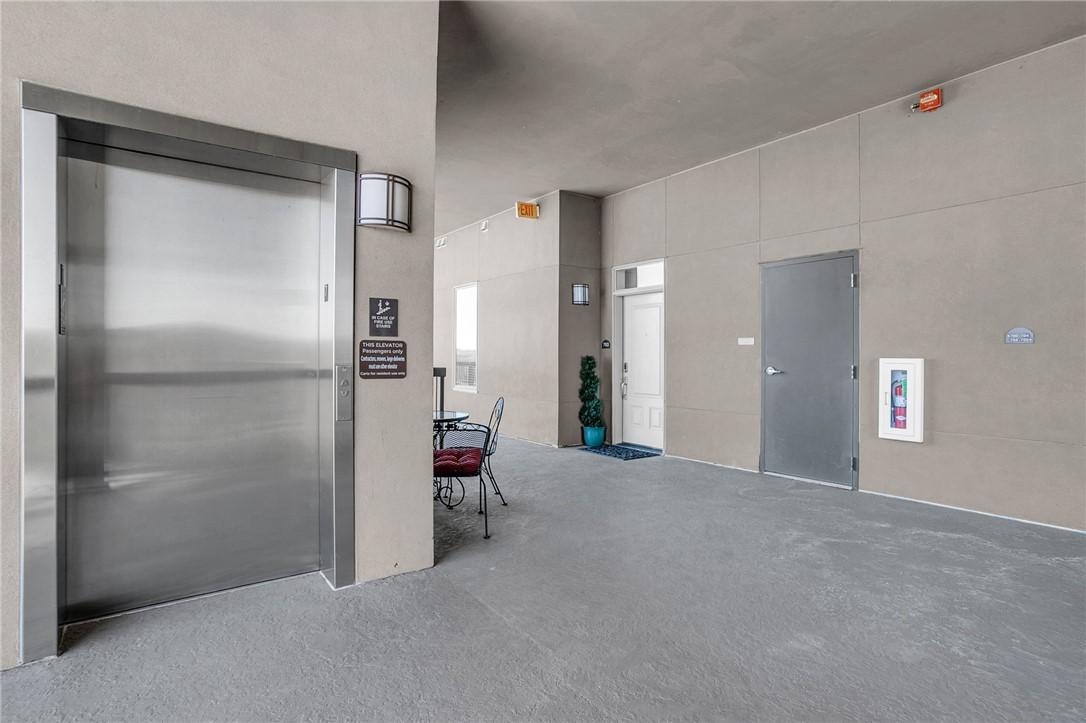 Image 2: This sleek entryway boasts convenient access, pres