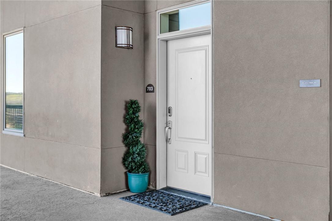 Image 3: This inviting entrance features a transom window a