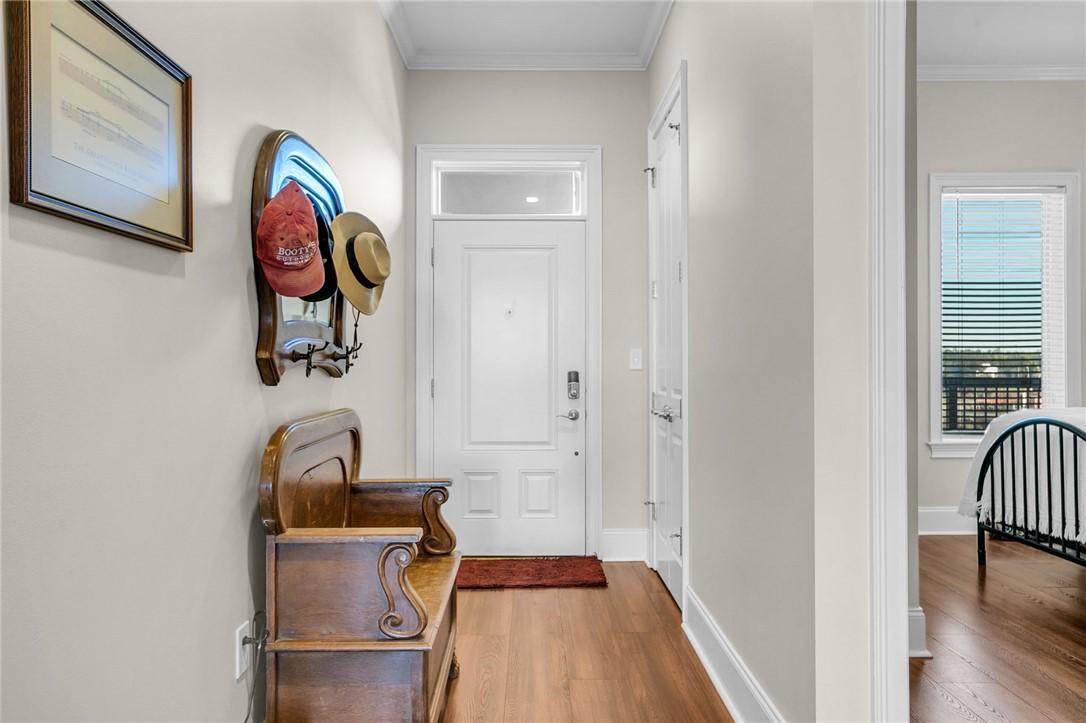 Image 4: Welcome home to this inviting entryway, boasting w
