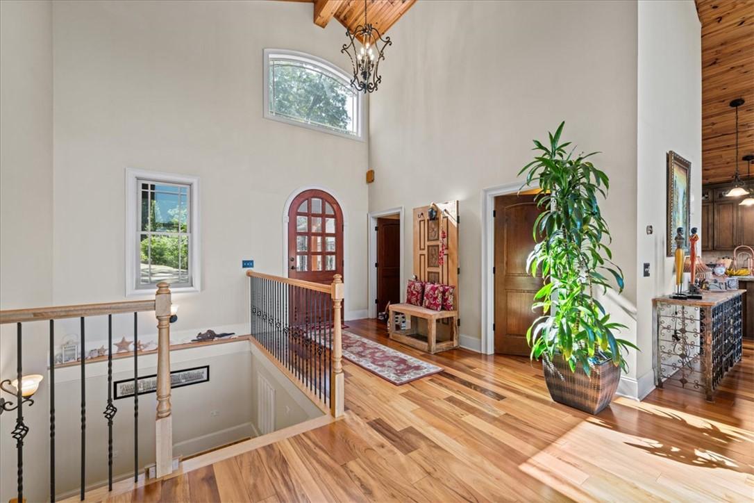 Image 4: Natural light floods this inviting entryway with w