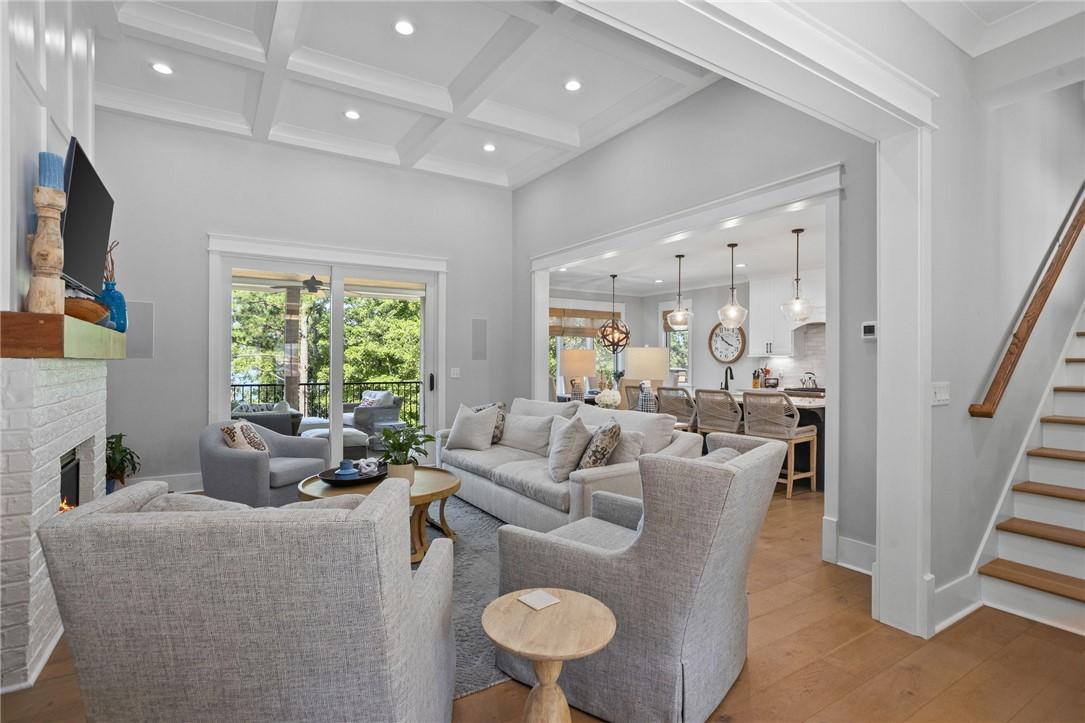 Image 4: An inviting open floorplan living area flows seaml