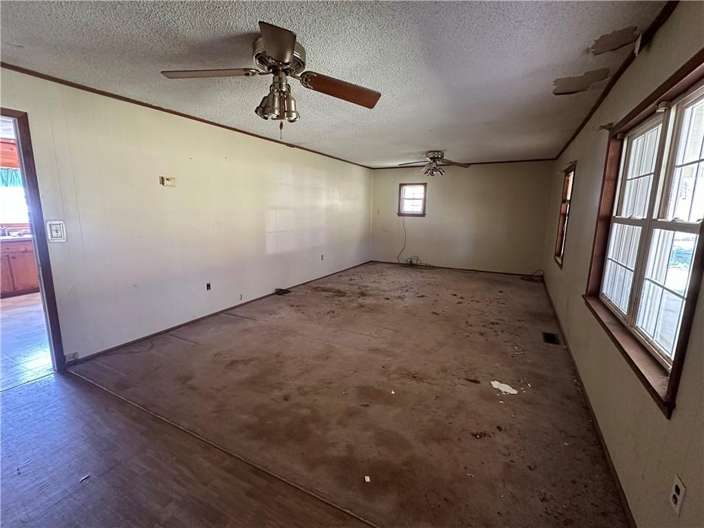 Image 3: This expansive room offers an open layout, ideal f